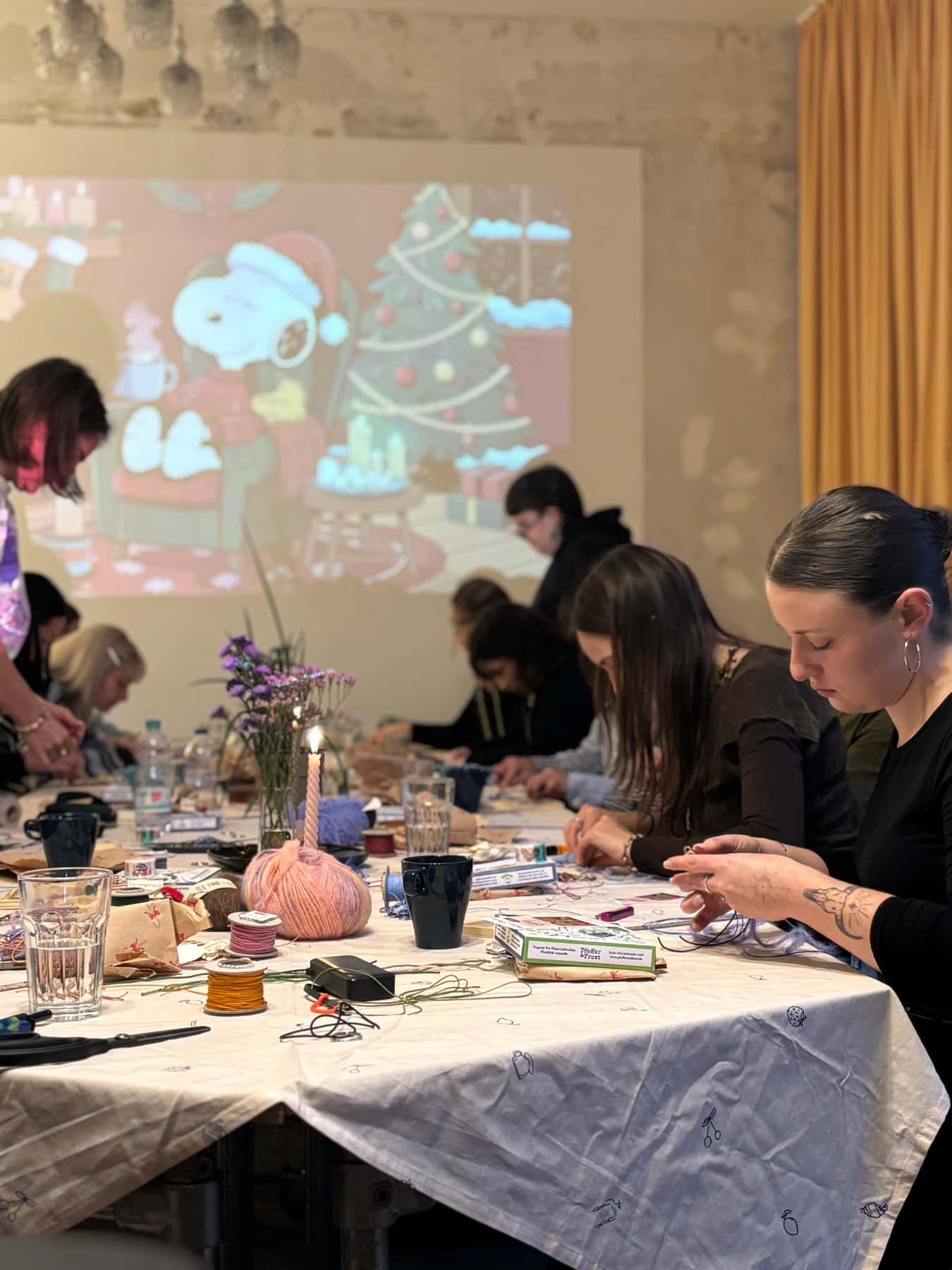 Guests creating together during an open craft workshop