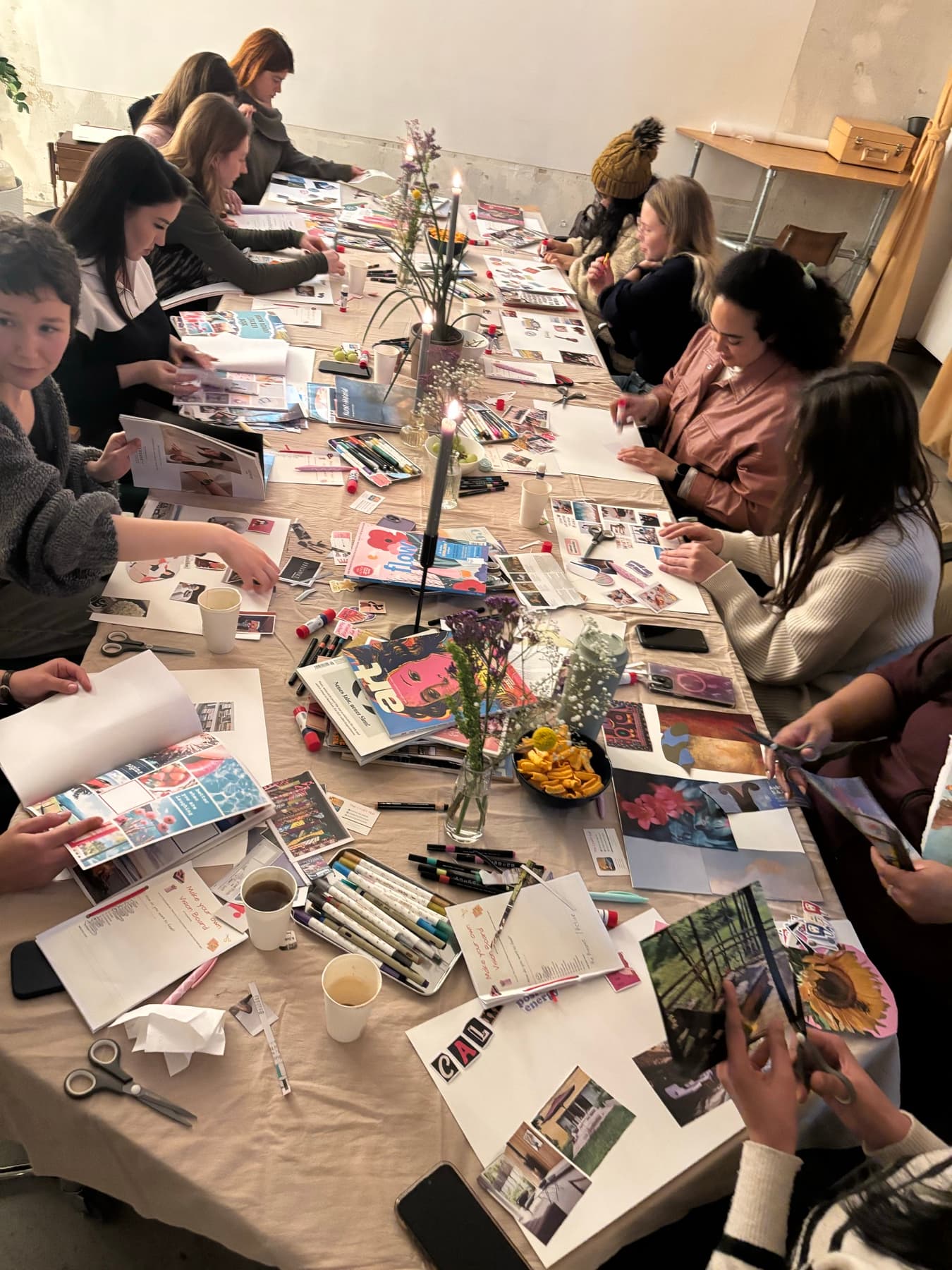 The Craft Hub community creating together around a workshop table