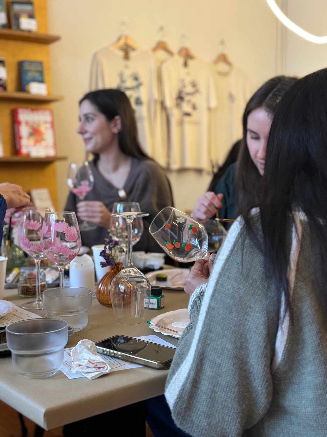 Guests painting glassware during a workshop