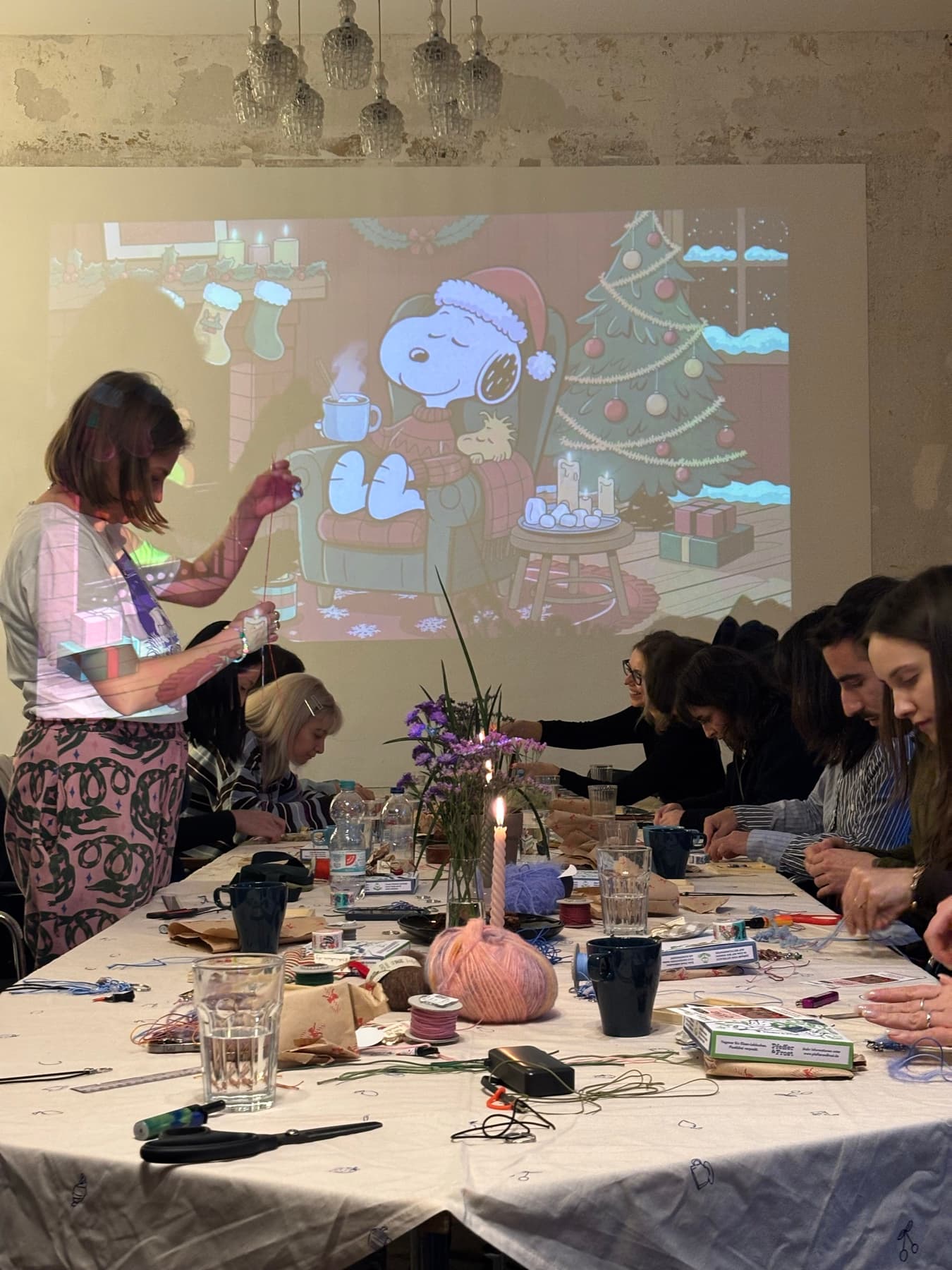 A hosted craft workshop with guests working around the table